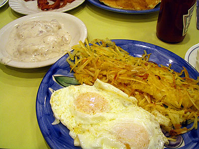 eggs over easy, hash browns and biscuits and gravy