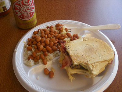 A Cuban sandwich, pinto beans, rice and Materva soda