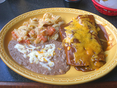 Chicken and Beef Enchiladas with potatoes and refried beans at Jalapeno's Mex Mex