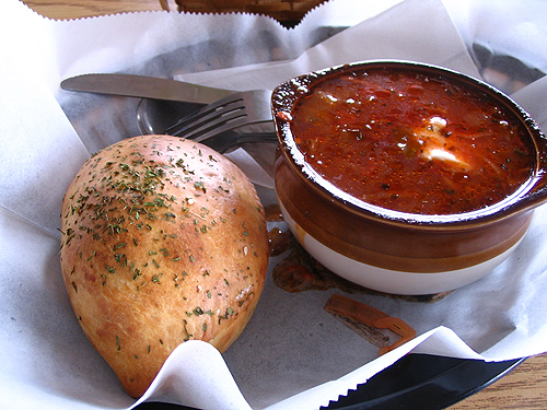 Beef and sauerkraut puff with bowl of Borscht